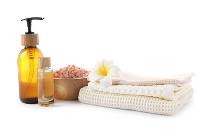 Photo of Spa composition with waffle towels and cosmetic products isolated on white