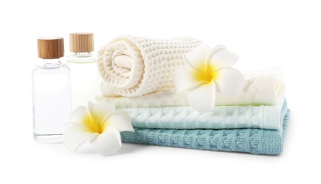 Photo of Spa composition with waffle towels and cosmetic products isolated on white