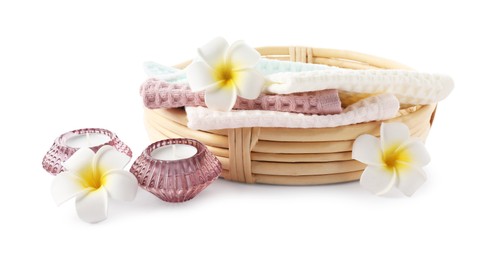 Photo of Spa composition with waffle towels and candles isolated on white