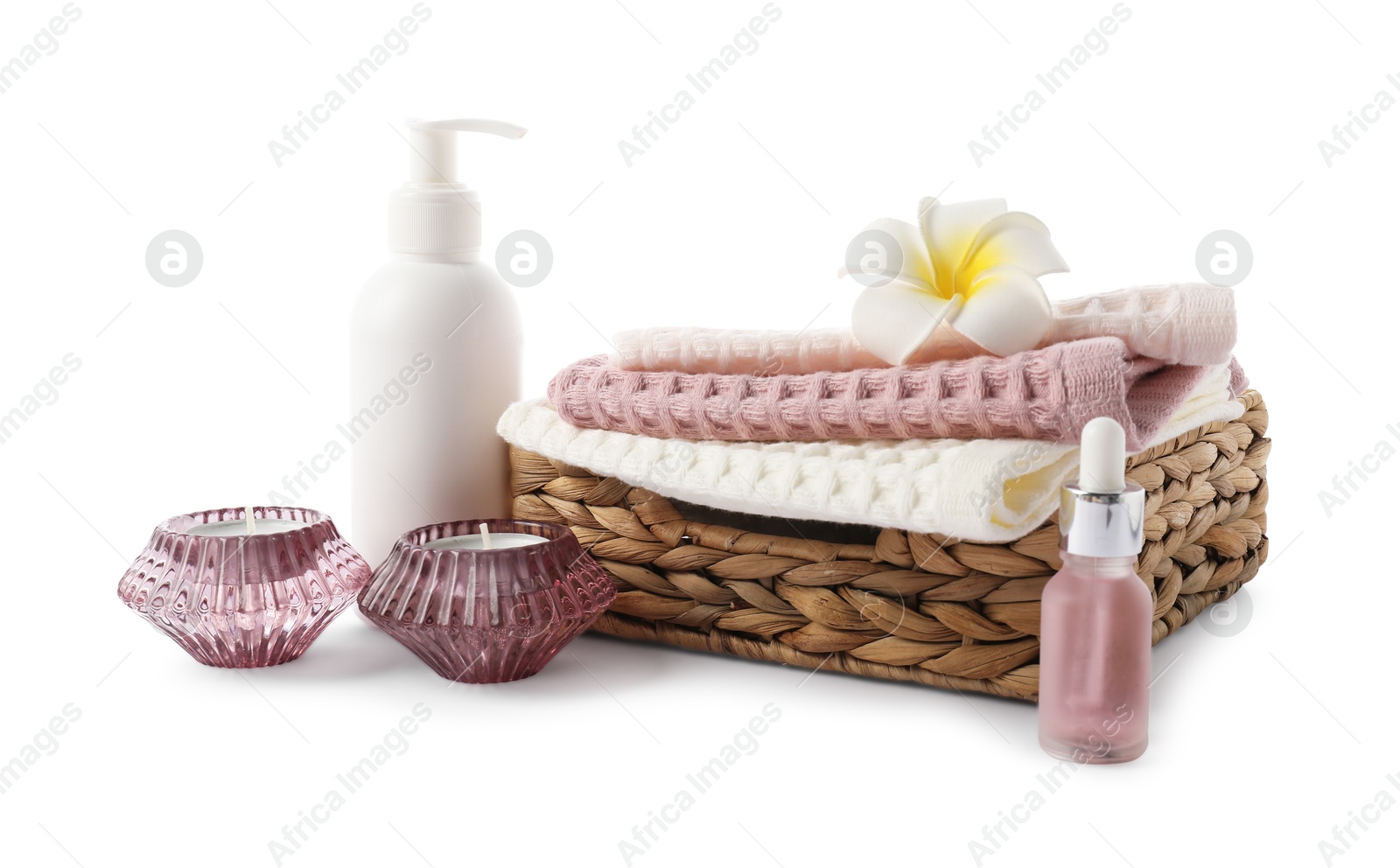 Photo of Spa composition with waffle towels and cosmetic products isolated on white