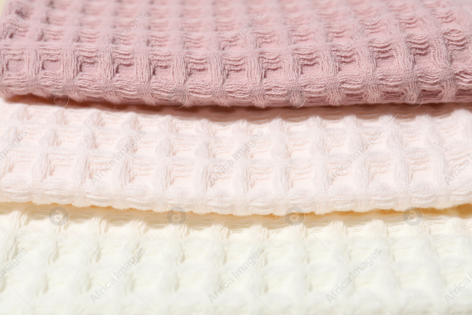 Photo of Clean waffle towels as background, closeup view