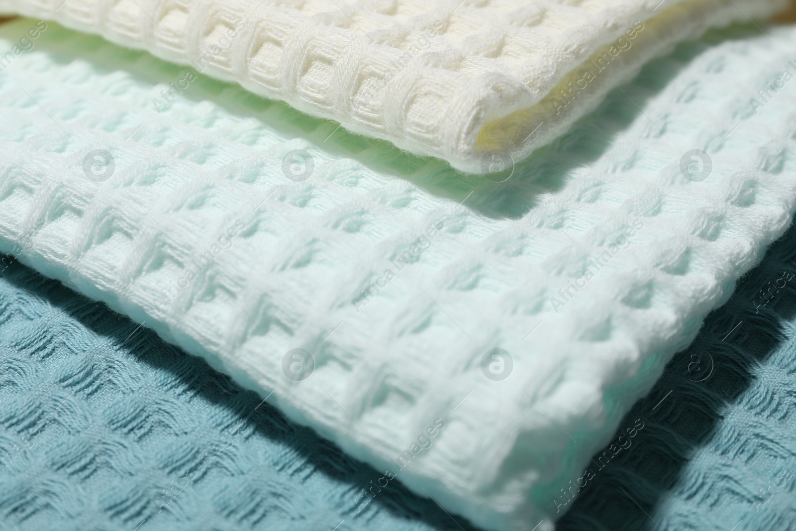 Photo of Clean waffle towels as background, closeup view
