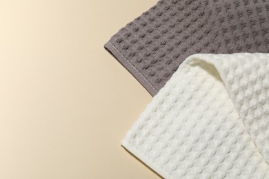 Photo of Clean waffle towels on beige background, top view. Space for text