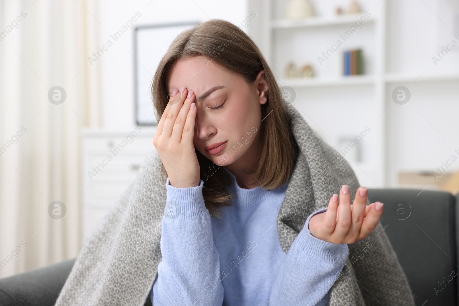 Sick woman suffering from headache at home. Online medical consultation Photo of Sick woman suffering from headache at home. Online medical consultation