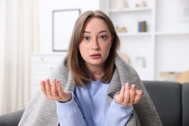 Photo of Portrait of sick woman at home. Online medical consultation