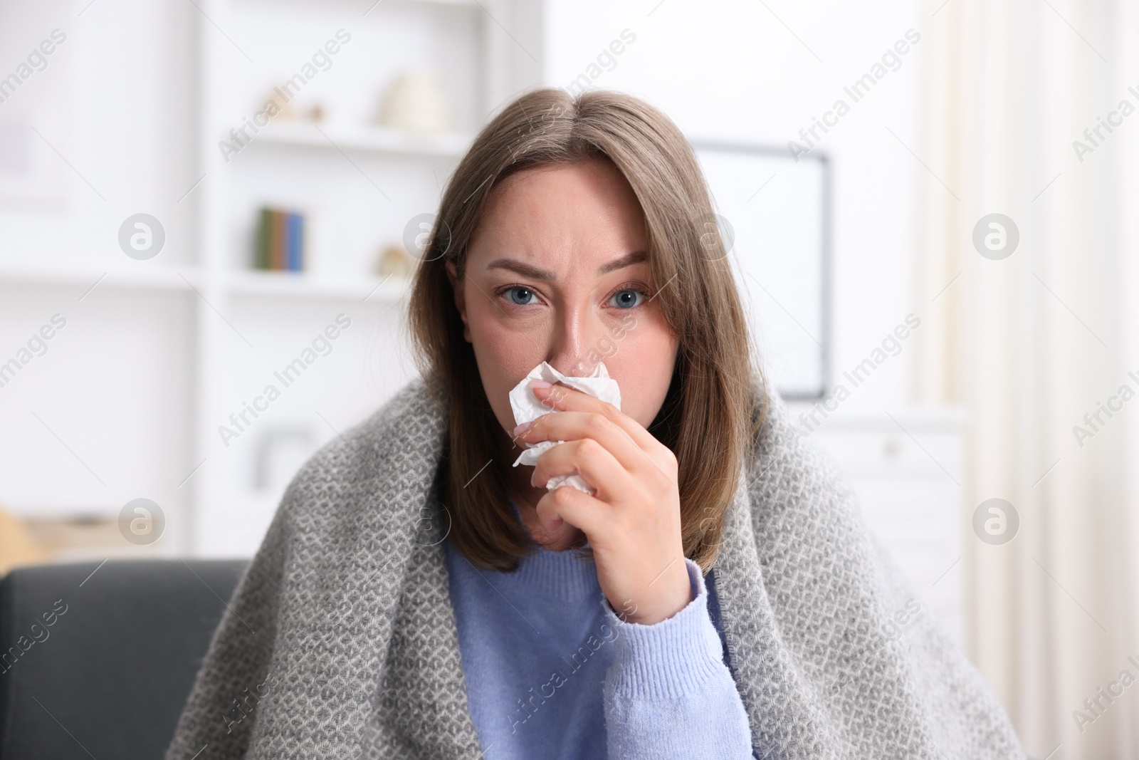 Sick woman with paper tissue at home. Online medical consultation Photo of Sick woman with paper tissue at home. Online medical consultation