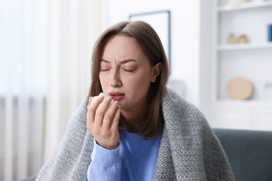 Photo of Portrait of sick woman at home. Online medical consultation
