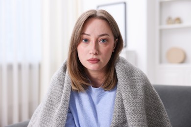 Photo of Portrait of sick woman at home. Online medical consultation