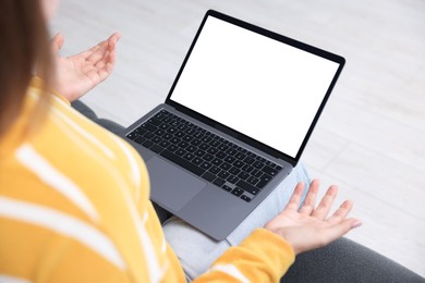 Photo of Woman having online consultation with doctor via laptop on sofa at home, closeup
