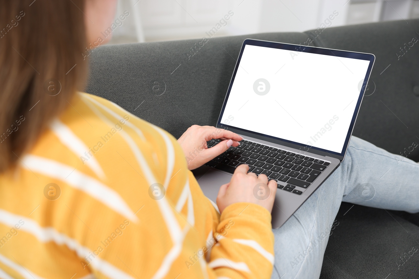 Photo of Woman having online consultation with doctor via laptop on sofa at home, closeup