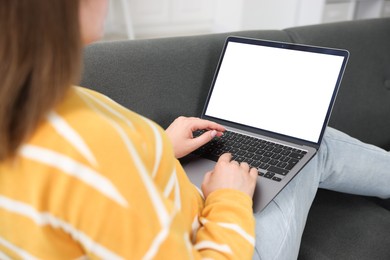 Photo of Woman having online consultation with doctor via laptop on sofa at home, closeup