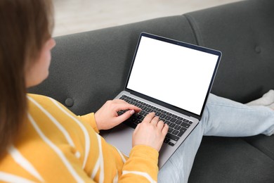 Photo of Woman having online consultation with doctor via laptop on sofa at home, closeup