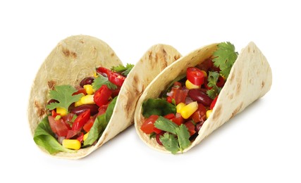 Photo of Tasty vegetarian tacos with beans and vegetables isolated on white
