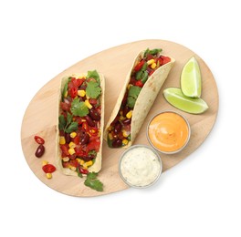 Photo of Tasty vegetarian tacos with beans, vegetables, sauces and lime isolated on white, top view