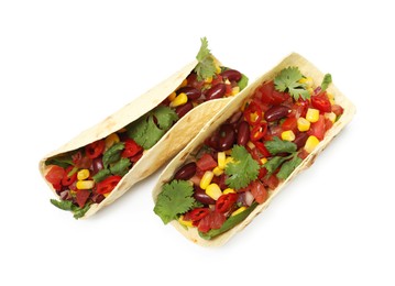 Photo of Tasty vegetarian tacos with beans and vegetables isolated on white, top view