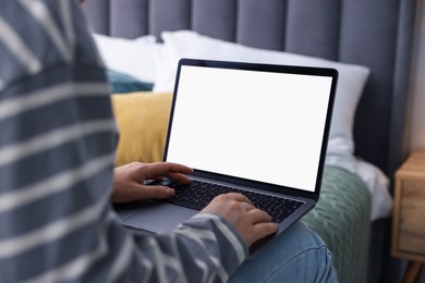 Photo of Woman having online consultation with doctor via laptop on bed at home, closeup