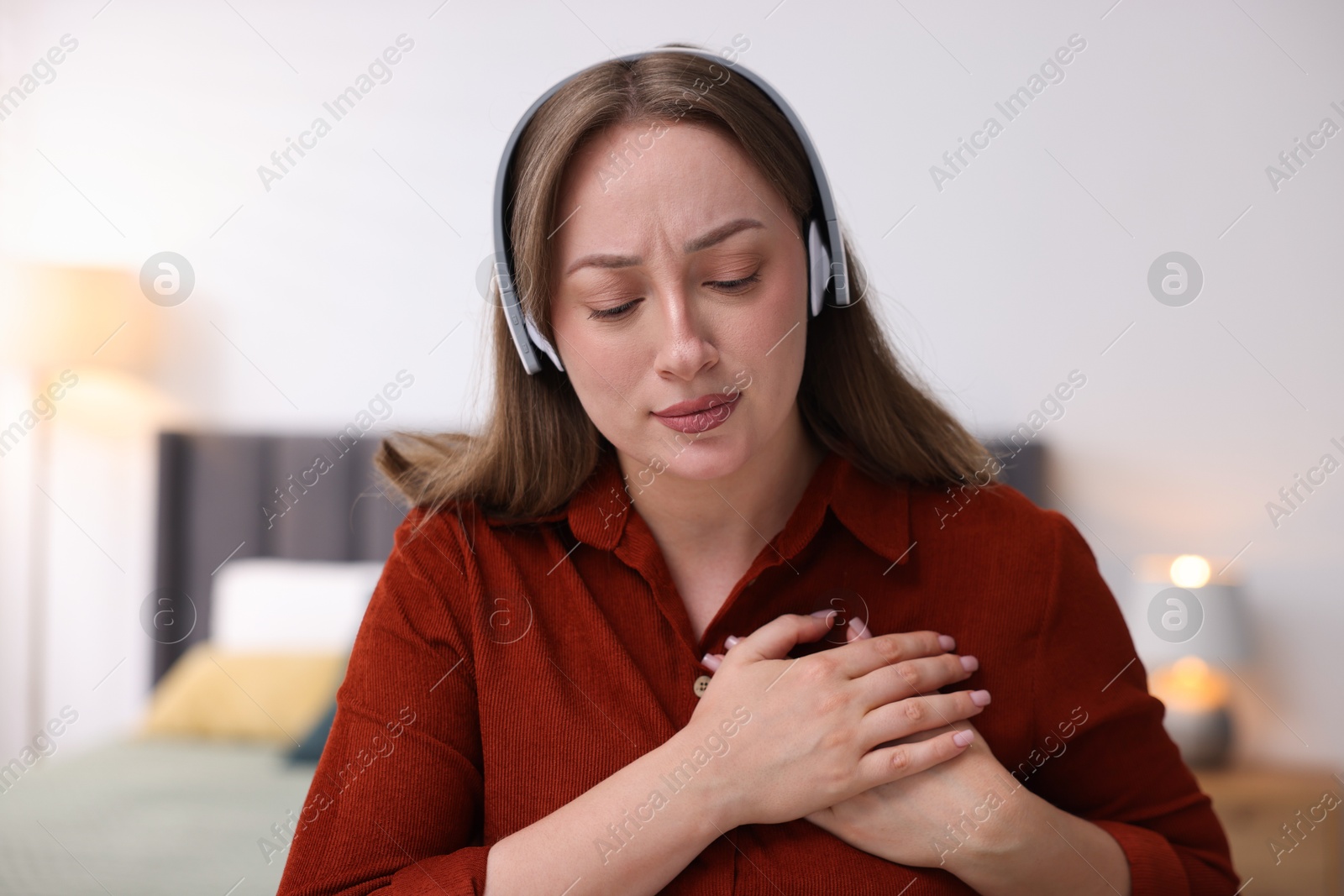 Woman in headphones having online consultation with doctor at home Photo of Woman in headphones having online consultation with doctor at home
