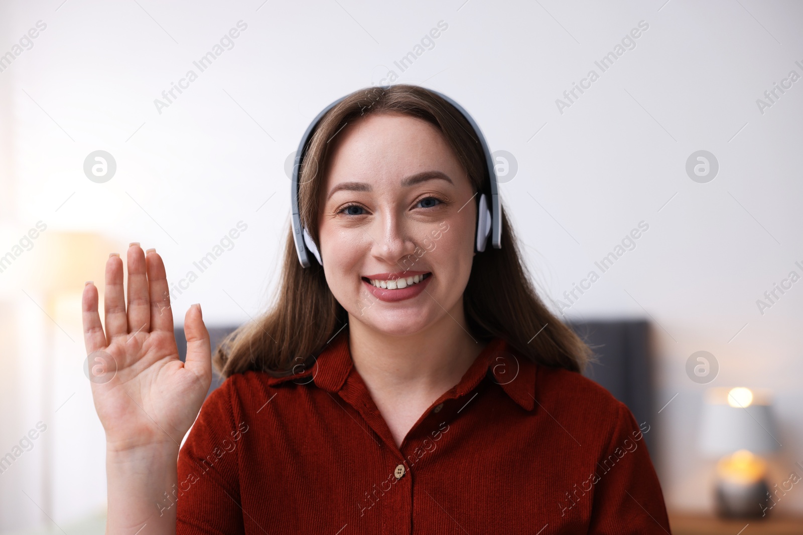 Woman in headphones having online consultation with doctor at home Photo of Woman in headphones having online consultation with doctor at home