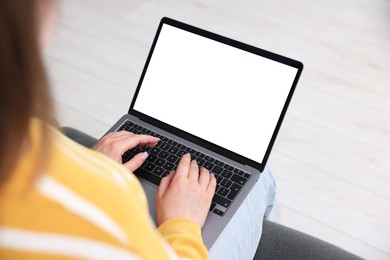 Photo of Woman having online consultation with doctor via laptop on sofa at home, closeup