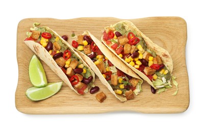 Photo of Tasty vegetarian tacos with beans, tofu, vegetables, guacamole and lime isolated on white, top view