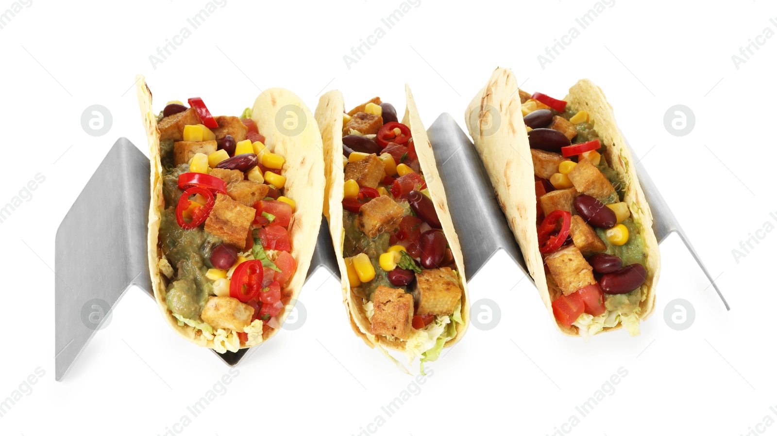 Photo of Tasty vegetarian tacos with beans, tofu, vegetables and guacamole isolated on white
