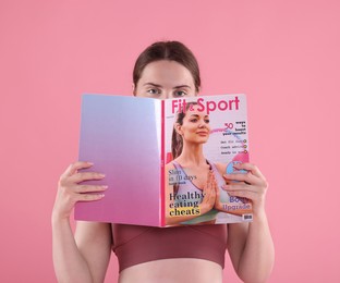 Photo of Woman with lifestyle magazine on pink background