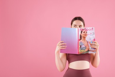 Photo of Woman with lifestyle magazine on pink background, space for text