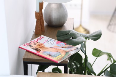 Photo of Lifestyle magazines on wooden table indoors, closeup
