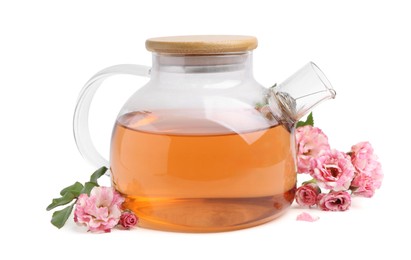Photo of Tasty rose tea in glass teapot, flowers and leaves isolated on white