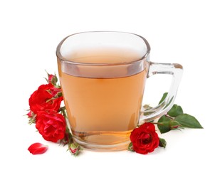 Photo of Tasty rose tea in glass cup and flowers isolated on white
