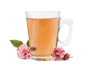 Photo of Tasty rose tea in glass cup and flowers isolated on white