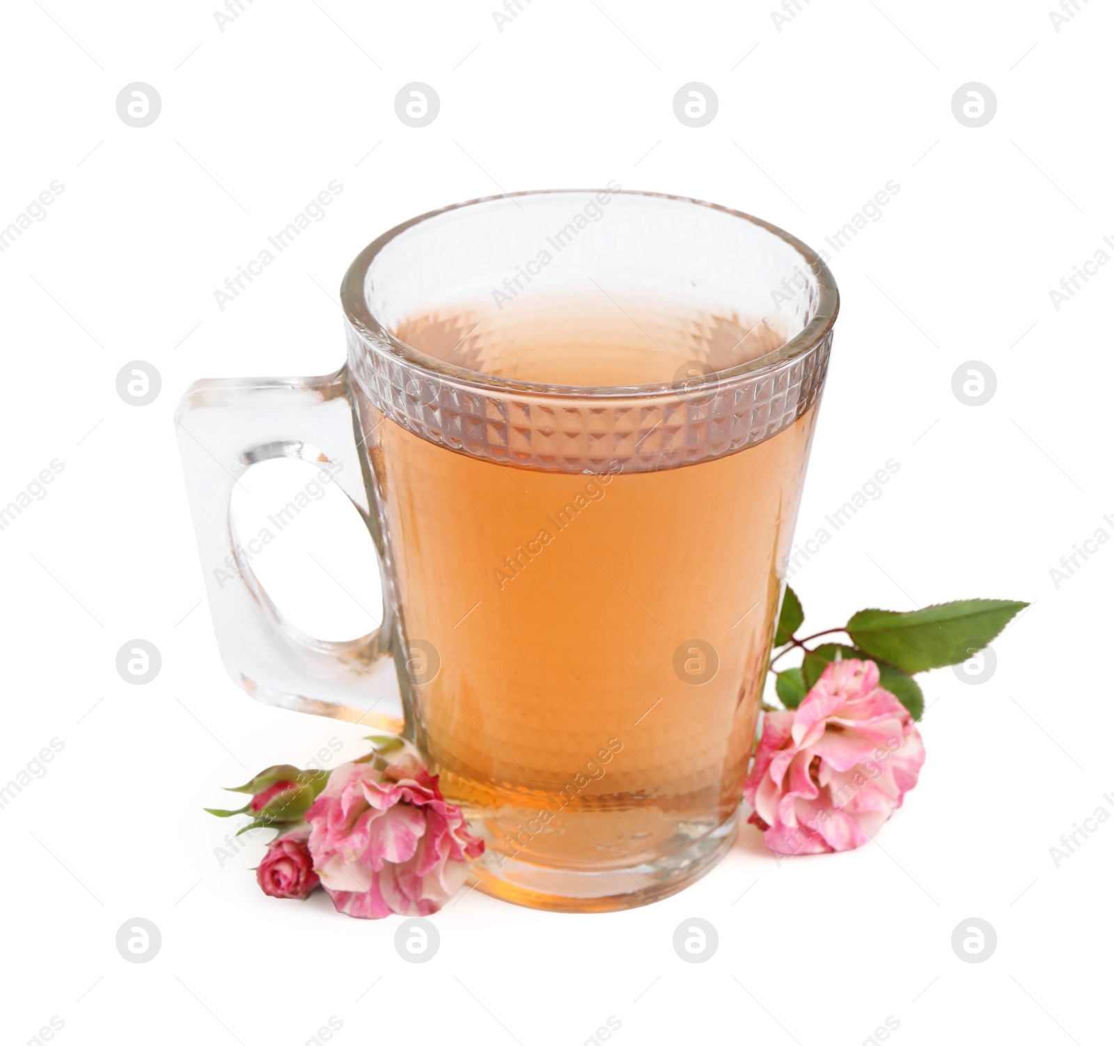 Photo of Tasty rose tea in glass cup and flowers isolated on white
