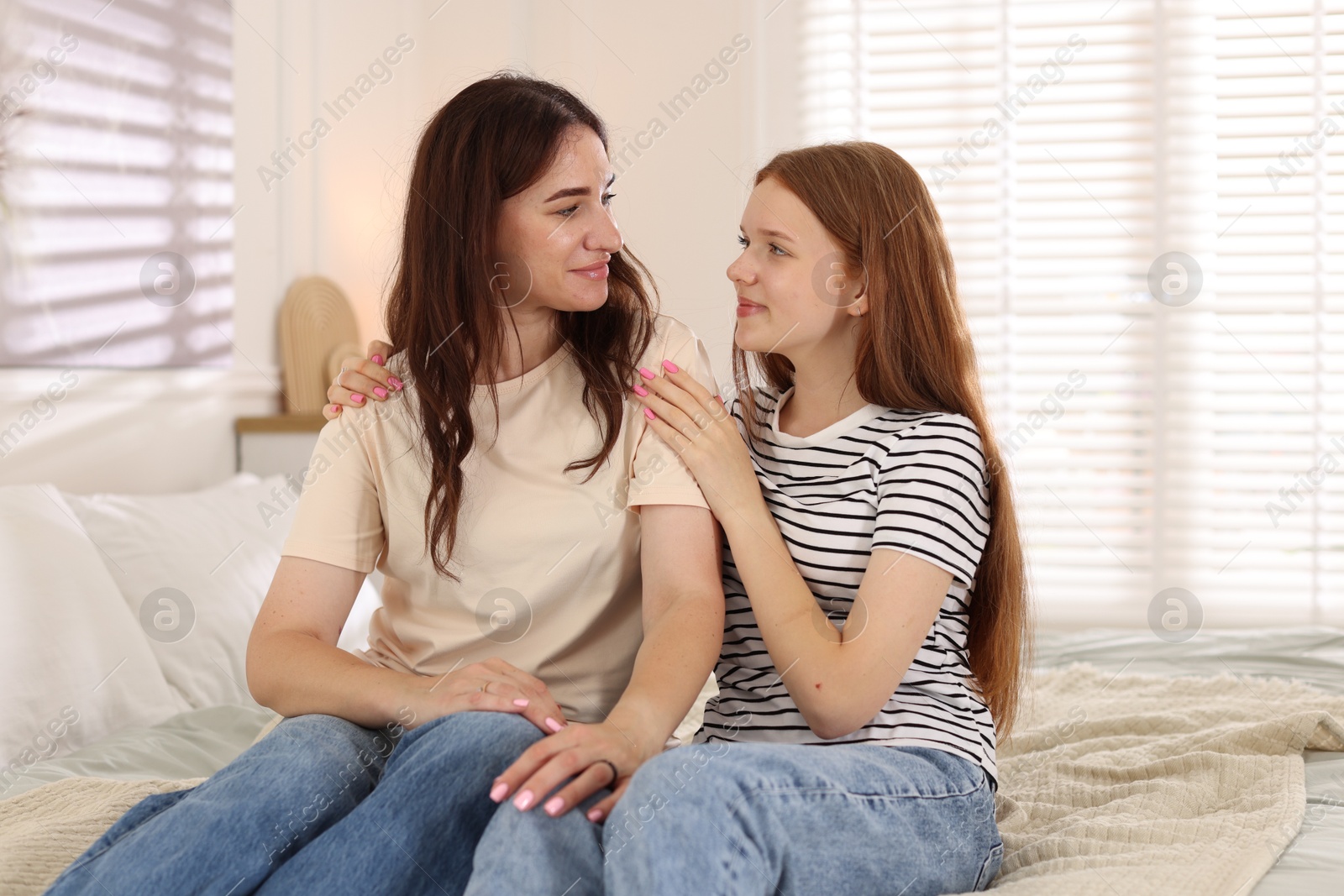 Mother and her teenage daughter spending time together at home Photo of Mother and her teenage daughter spending time together at home