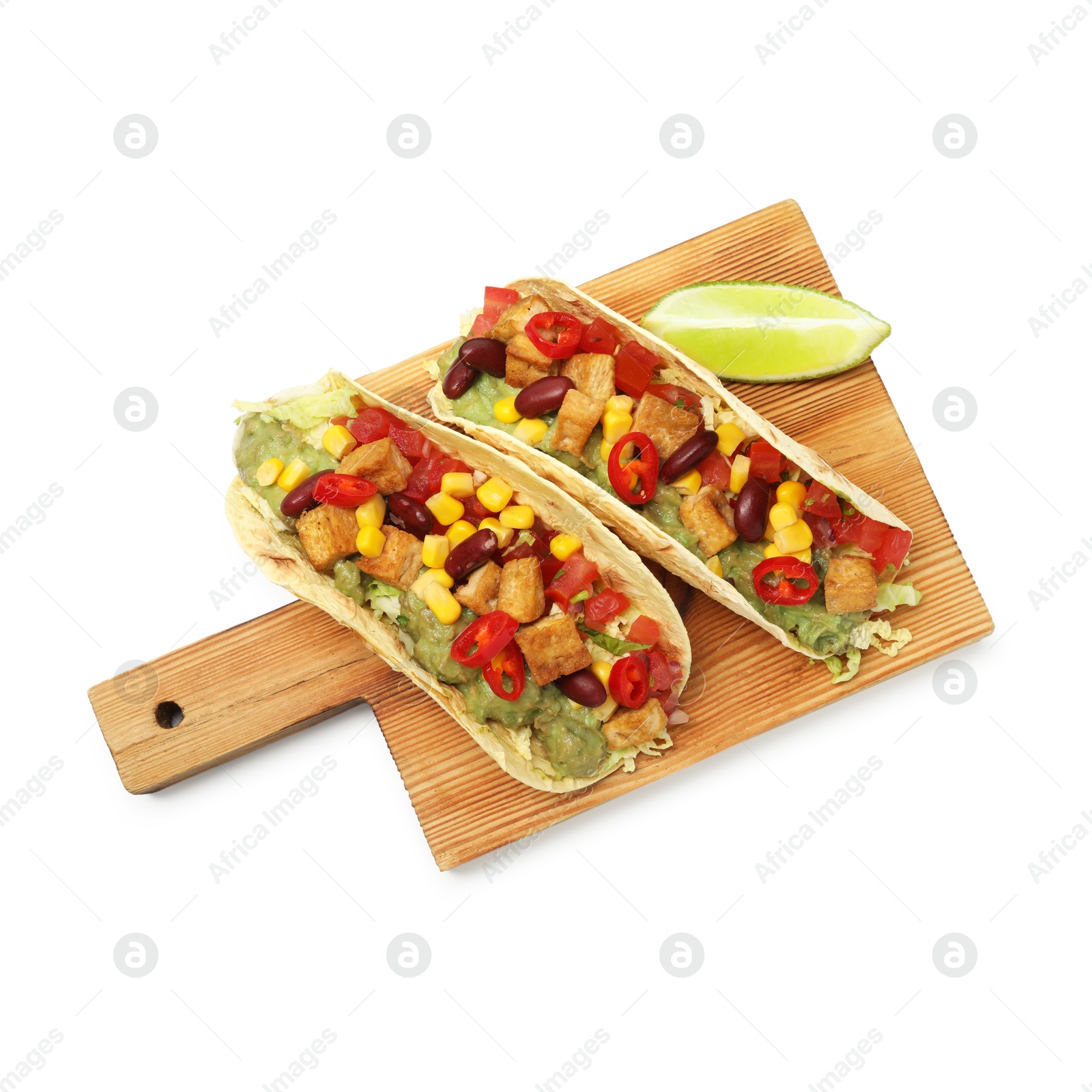 Photo of Tasty vegetarian tacos with beans, tofu, vegetables and lime isolated on white, top view