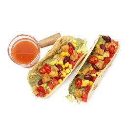 Photo of Tasty vegetarian tacos with beans, tofu, vegetables and sauce isolated on white, top view