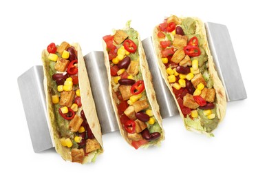 Photo of Tasty vegetarian tacos with beans, tofu, vegetables and guacamole isolated on white, top view