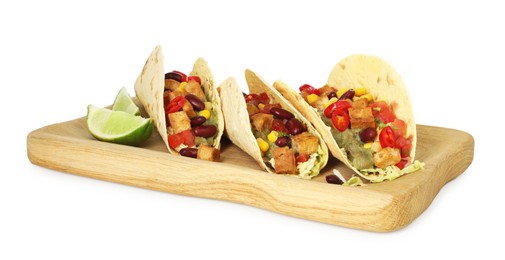 Photo of Tasty vegetarian tacos with beans, tofu, vegetables, guacamole and lime isolated on white