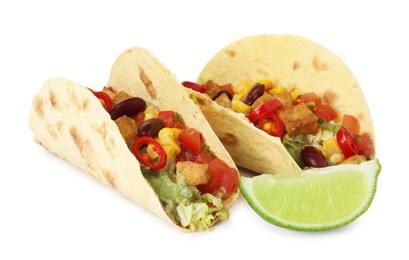Photo of Tasty vegetarian tacos with beans, tofu, vegetables, guacamole and lime isolated on white