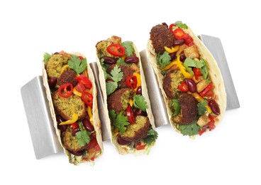Photo of Tasty vegetarian tacos with falafel, tofu, beans and vegetables isolated on white, top view