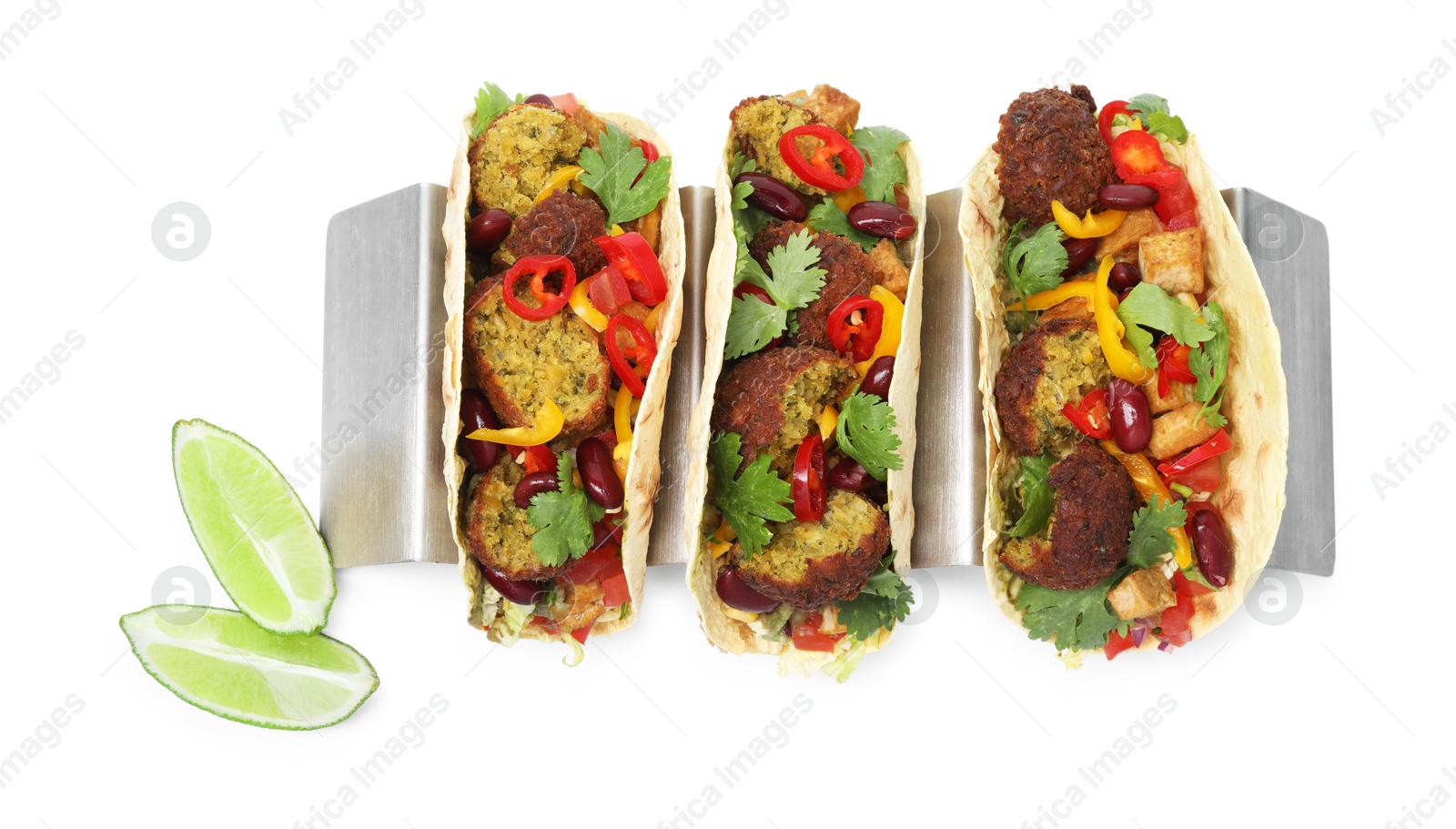 Photo of Tasty vegetarian tacos with falafel, tofu, beans, vegetables and lime isolated on white, top view