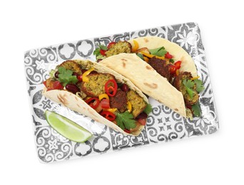 Photo of Tasty vegetarian tacos with falafel, tofu, beans, vegetables and lime isolated on white, top view