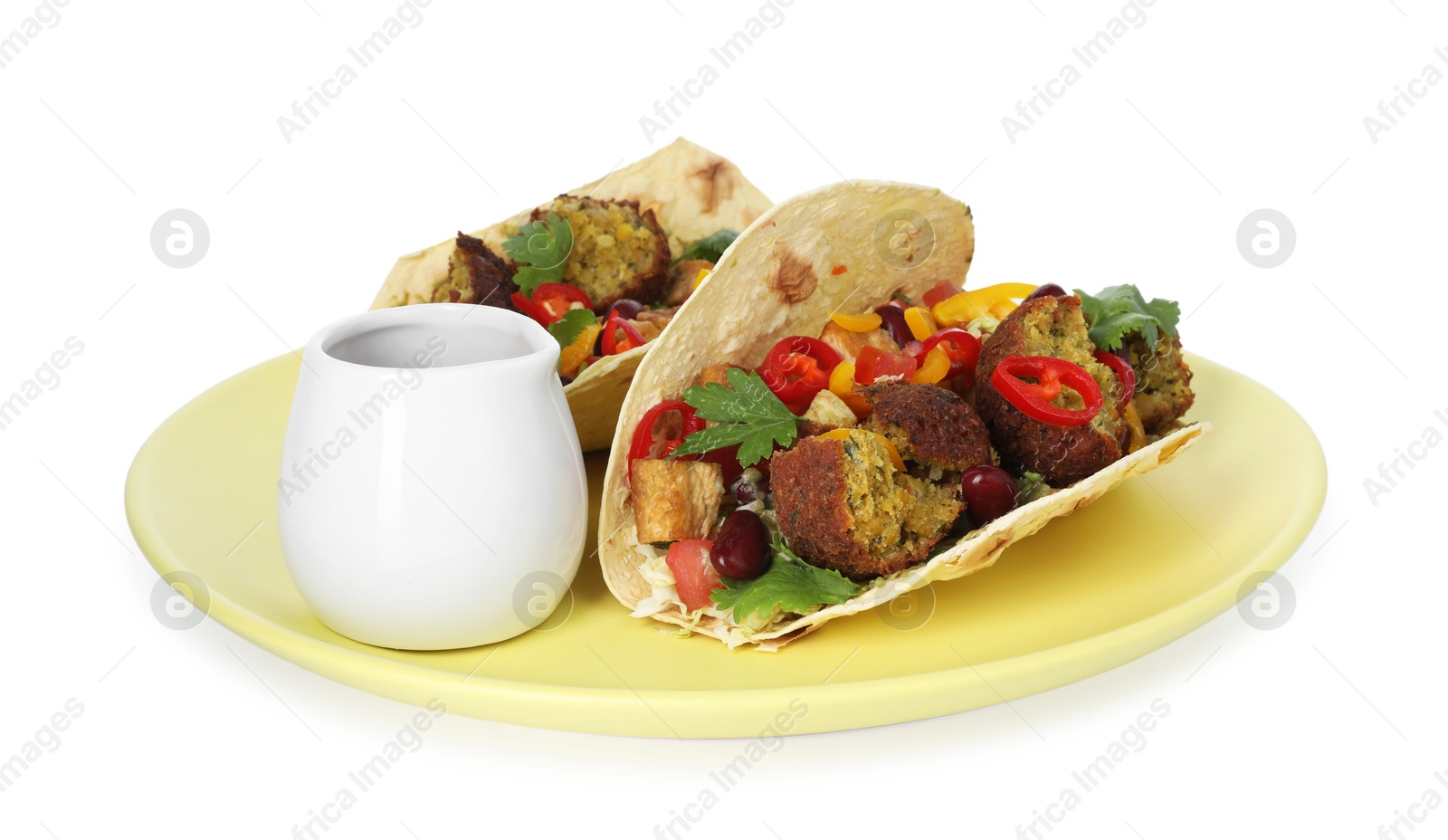 Photo of Tasty vegetarian tacos with falafel, tofu, beans, vegetables and sauce isolated on white