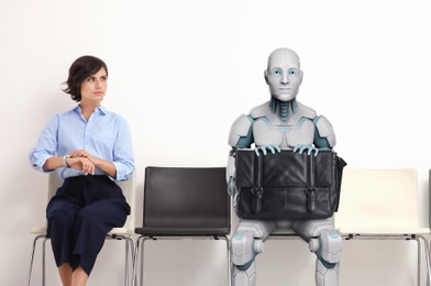 Image of Young woman and robot waiting for job interview. Replacing human workers with artificial intelligence