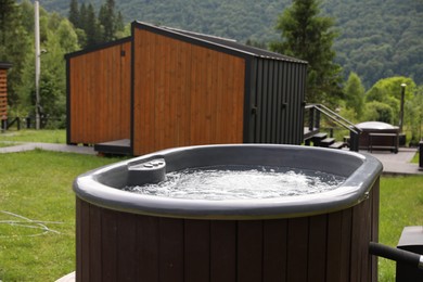 Photo of Tub with hot water at luxury resort in mountains