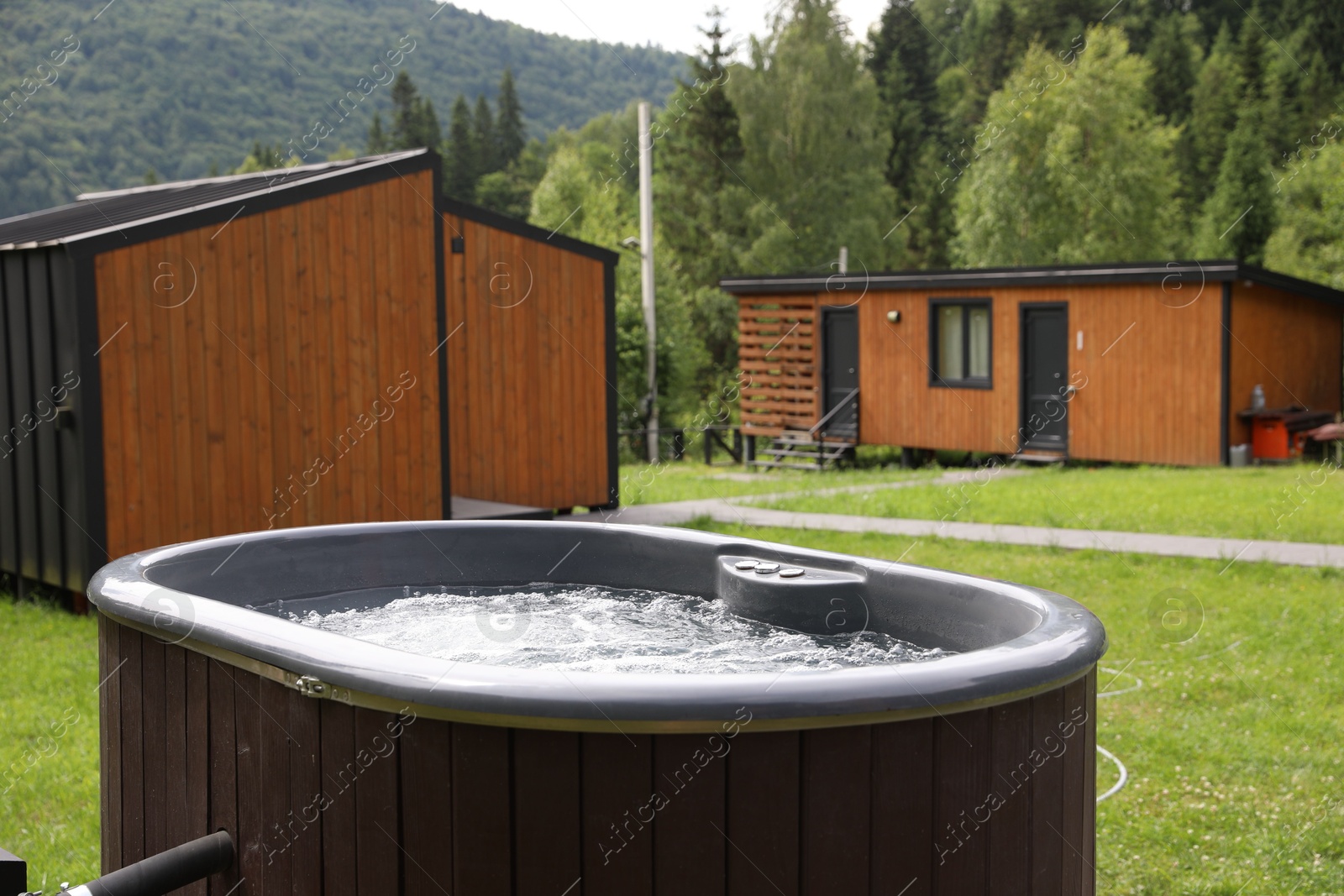 Photo of Tub with hot water at luxury resort in mountains
