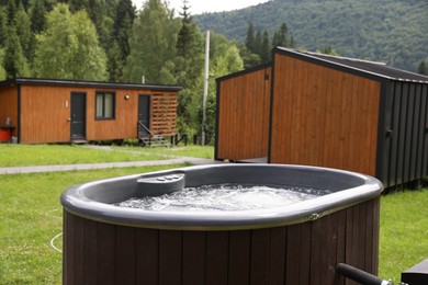 Photo of Tub with hot water at luxury resort in mountains