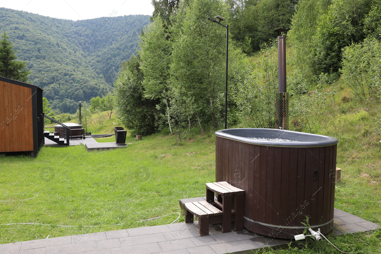 Photo of Tub with hot water at luxury resort in mountains
