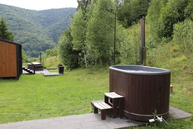 Photo of Tub with hot water at luxury resort in mountains