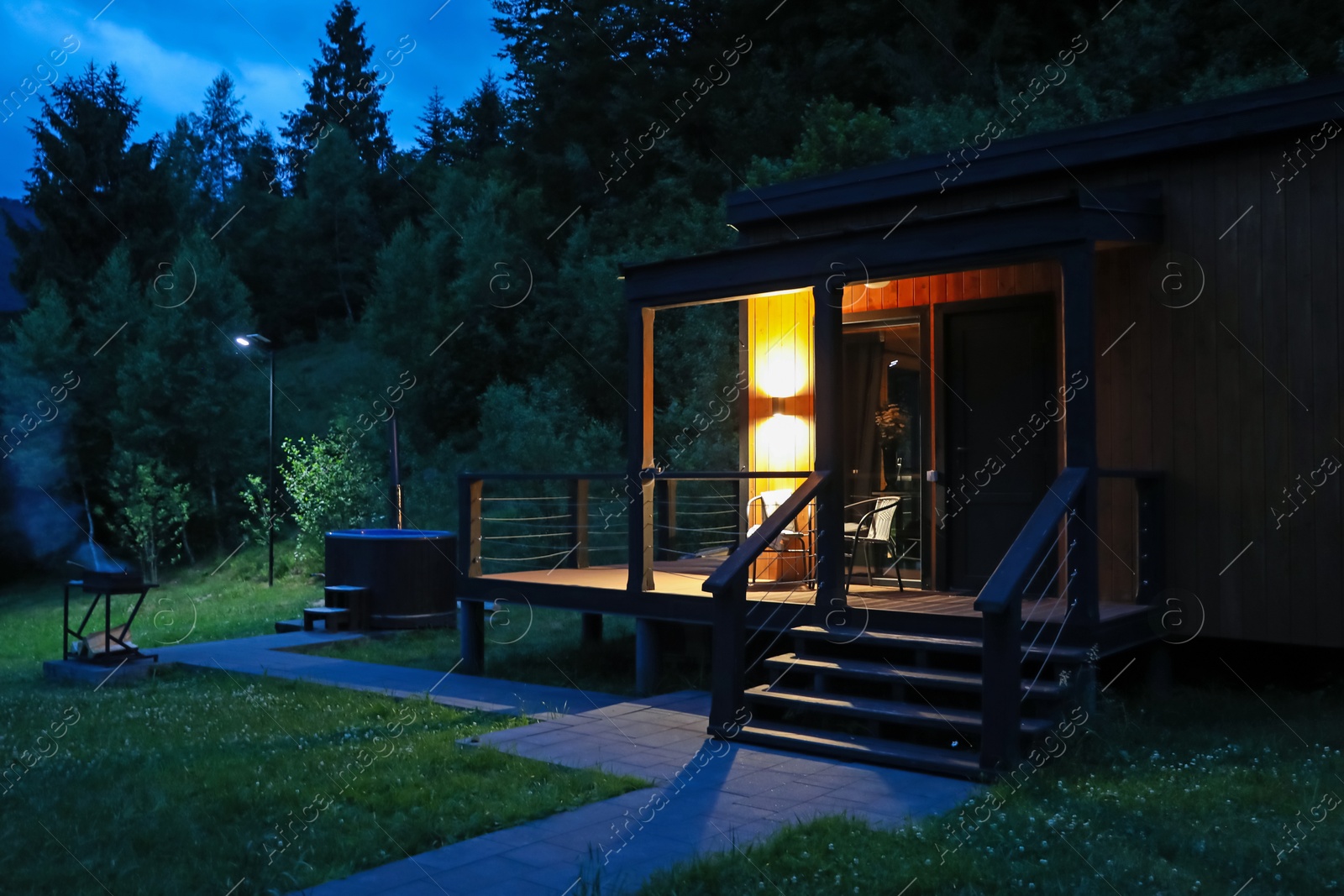 Picturesque view of luxury hotel in mountains at night Photo of Picturesque view of luxury hotel in mountains at night