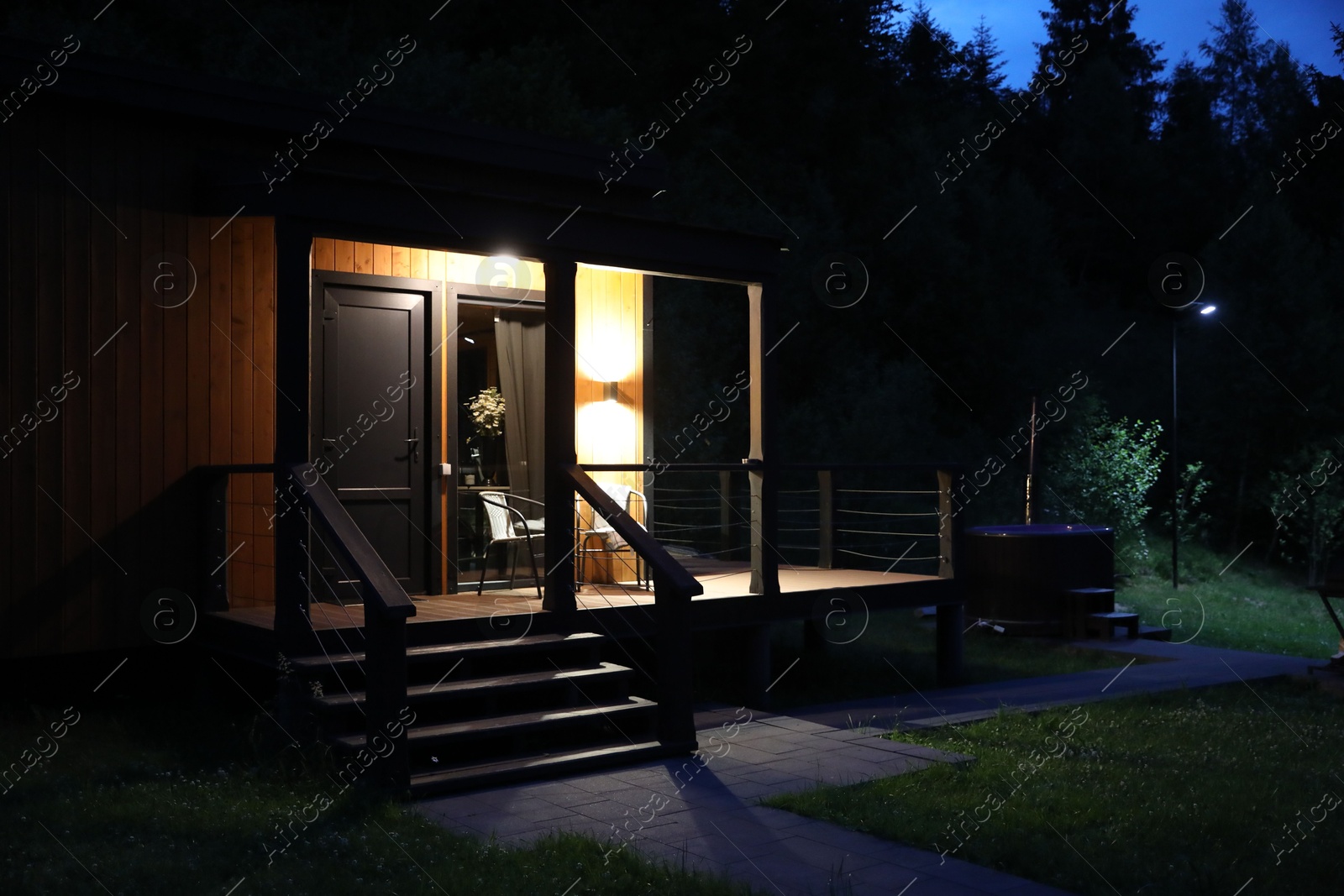 Picturesque view of luxury hotel in mountains at night Photo of Picturesque view of luxury hotel in mountains at night